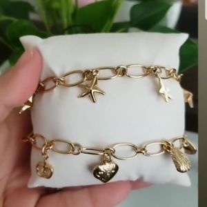 18k Gold plated clasping Bracelets.